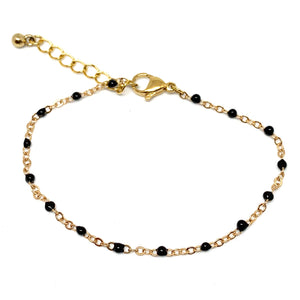 Bracelet chaîne dorée et perles noires